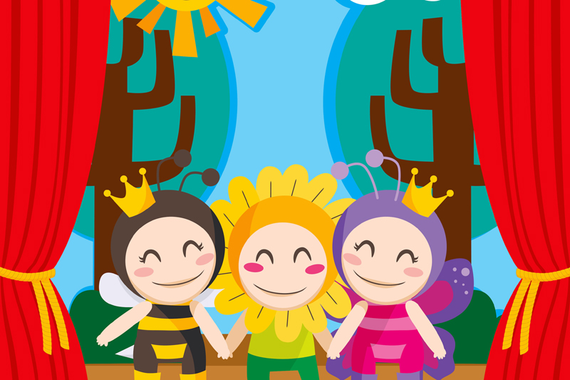 Three children in costumes performing a theater play on stage