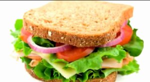 Lily is answering five questions in this video.      * What do you have for breakfast?     * Do you have school dinners or a packed lunch?     * What is your favourite food?     * What is your least favourite food?     * Do you like cooking?  Listen to her answers.