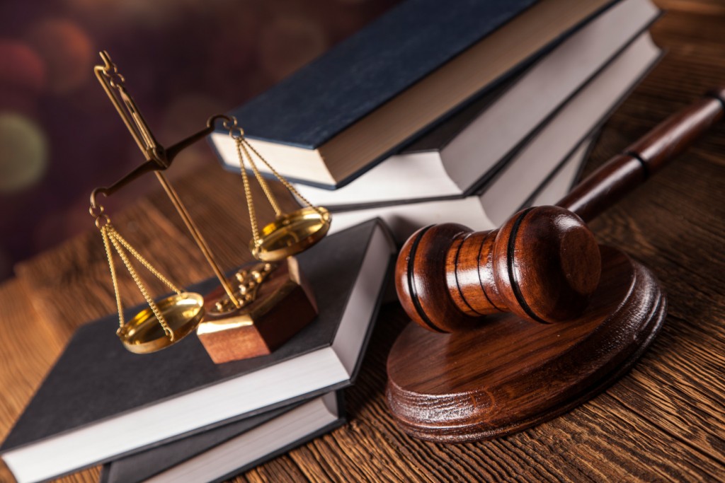 Mallet, legal code and scales of justice. Law concept, studio shots